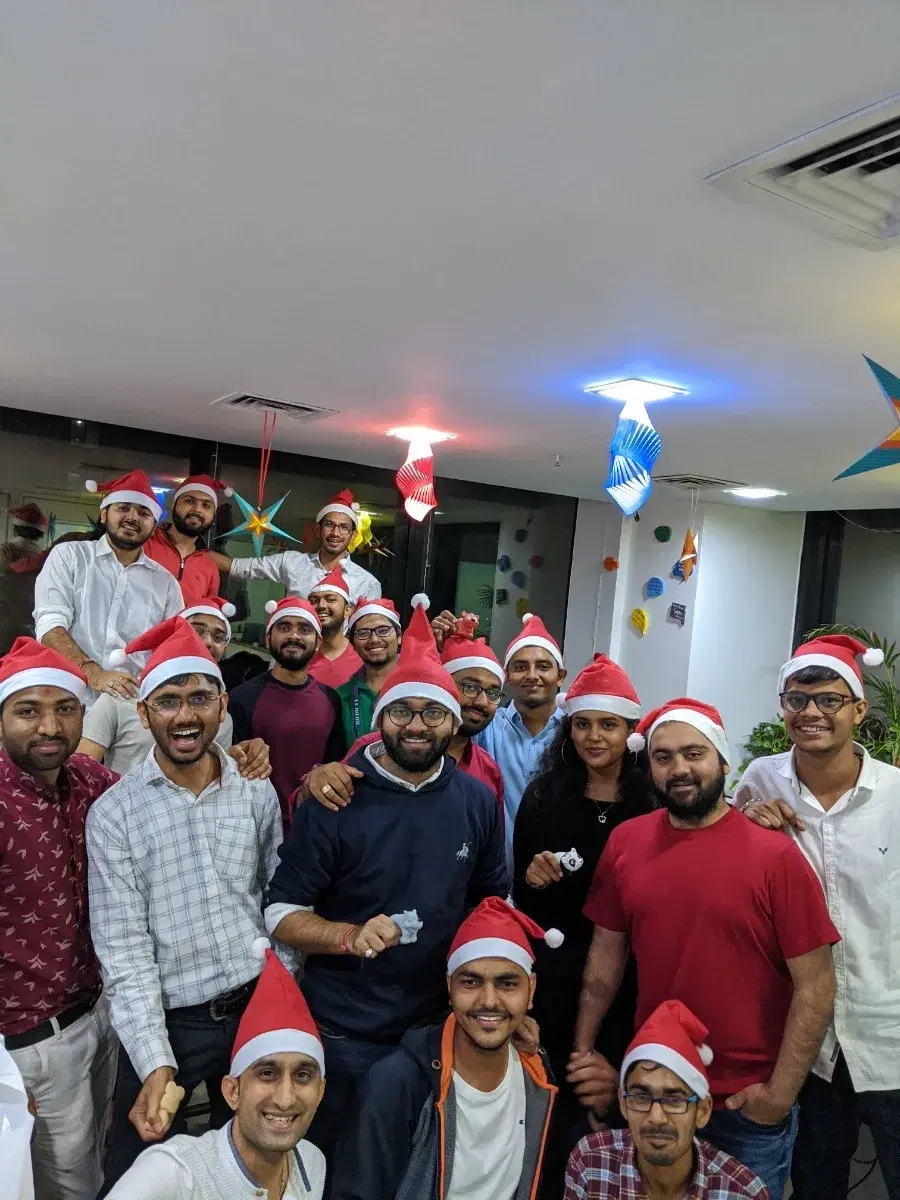 The Nividata team in Santa hats at a Christmas celebration