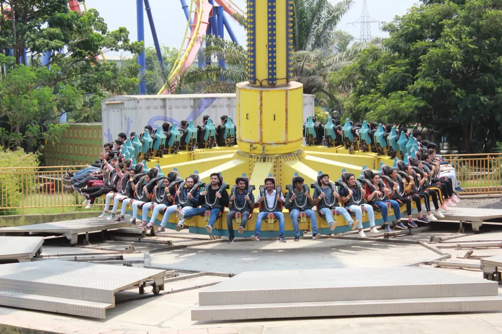 The Nividata team on a ride during a company outing to an amusement park